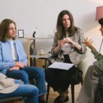 Woman discussing problem during group therapy